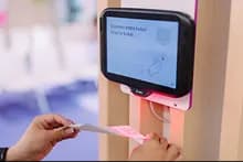 Scan terminal with a person scanning a QR code