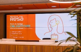 screens on an orange wall
